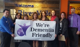 IncredibleBank employees receiving the dementia-friendly award